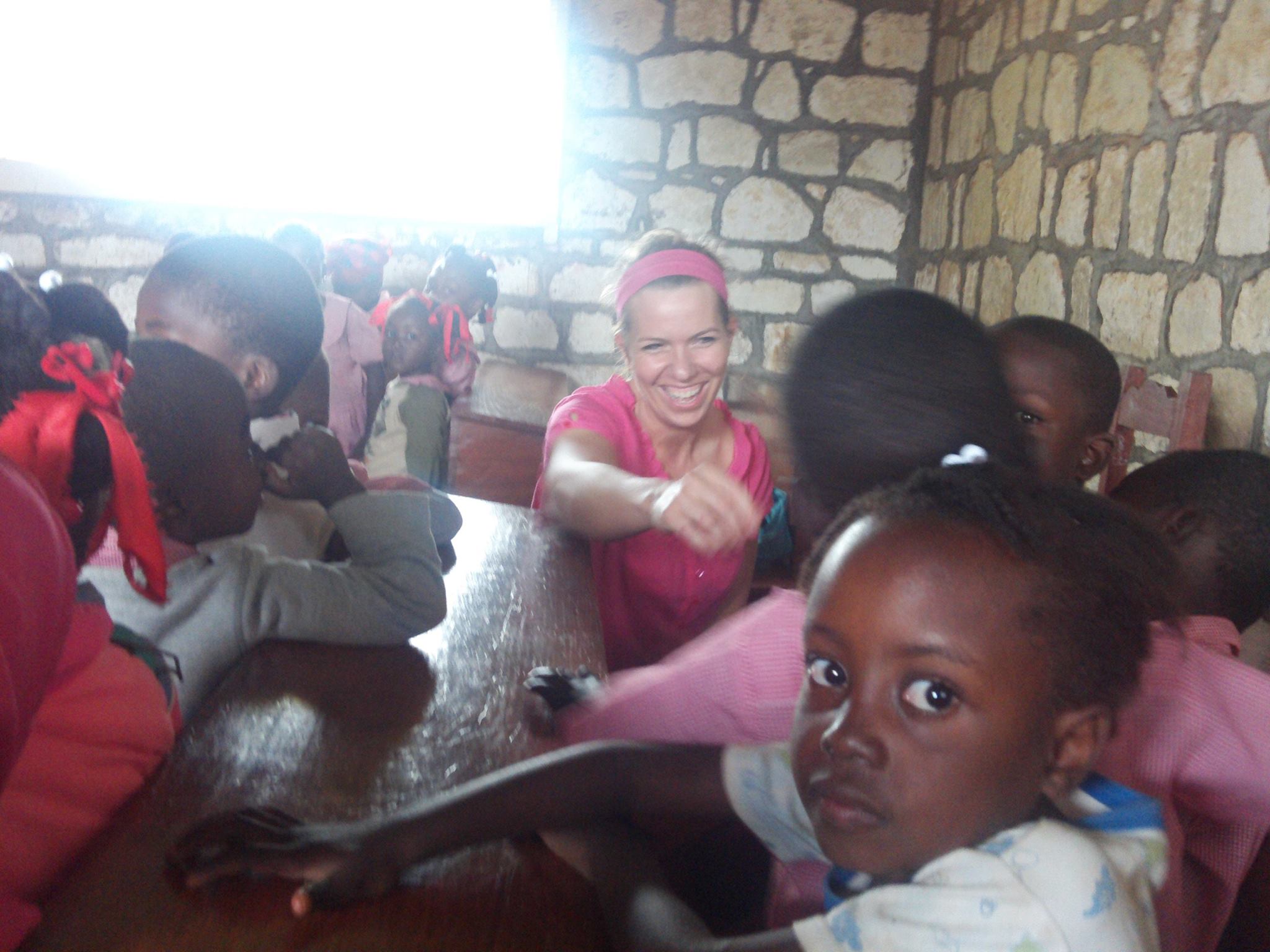 Jayme Sinclair working with children in Haiti